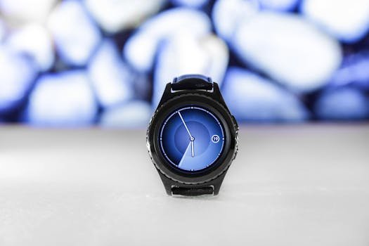 A sleek digital smartwatch with a blue interface against an abstract blurred background. Stylish and modern.
